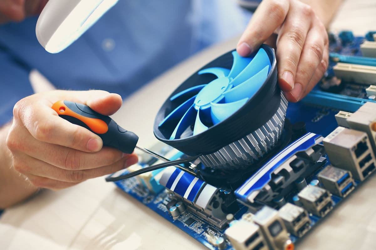 KTechnology Solutions IT support technician helping a customer in South Devon